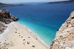 People and two ships at Kaputas beach in Turkey