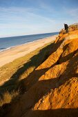 Red dunes and cliffs along beach in Sylt, Germany