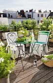 Garden chairs with loose covers and table on roof terrace