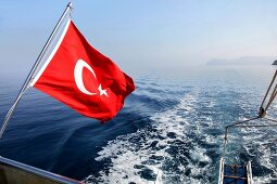 Flag of Turkey on boat in Dataca and Knidos, Turkey