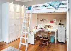 Bedroom with work place under loft bed with ladder