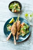 Barbecued Balinese skewers with a cucumber and papaya salad