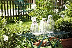 Candle wax on glass candle holders in garden