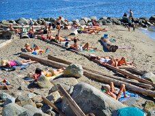 People relaxing on beach in Vancouver, British Columbia, Canada