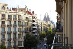 View of Sagrada Familia facade and street through building in Barceloan, Spain 