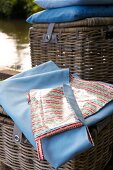 Close-up of blue picnic blanket with cutlery bag