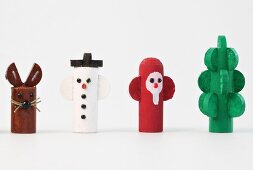 Colourful wooden figures on white background
