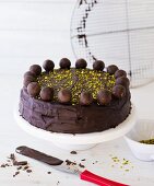 Chocolate cake decorated with Mozart pralines