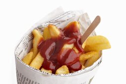Chips and ketchup wrapped in newspaper
