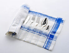 A cutlery bag made from an old tea towel
