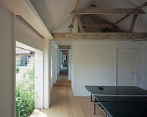 Table tennis table in the lobby of a converted barn