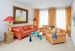 Living room with living room suite, glass top table and Chinese lamps