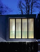 Illuminated contemporary house in the evening