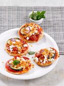 Mini pizzas topped with lentils