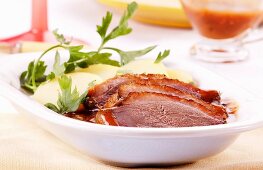 Roast goose breast with gravy and potatoes