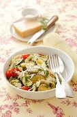 Pasta with courgettes, cherry tomatoes, herbs and Parmesan cheese
