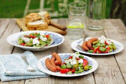 Frankfurters with a bean and pepper salad and goat's cheese
