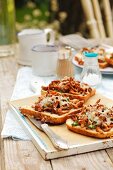 Toast topped with chanterelle mushrooms, herbs and cheese