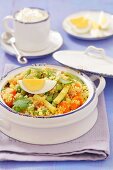 Couscous salad with green and yellow beans, eggs and dried apricots