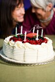 Two women with a birthday cake