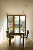 Dining table and four chairs in white dining room