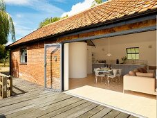 View from terrace into living room of a country house