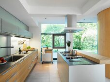 Open-plan kitchen with fitted units and island