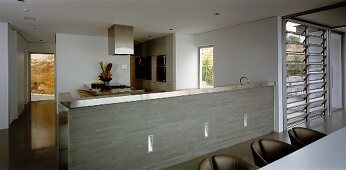 Open-plan, stainless steel kitchen