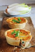 Chicory quiches with spring onions and tomatoes