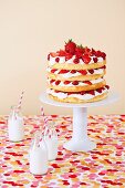 A sponge cake with berries and cream for a child's birthday