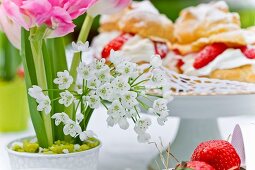 A flower arrangement for a coffee table featuring tulips and Star of Bethlehem