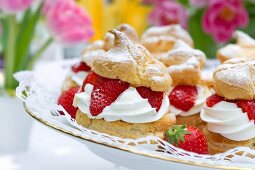 Profiteroles filled with strawberries and cream