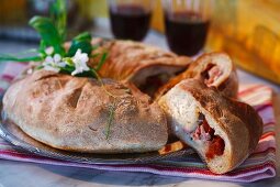 Bread stuffed with dried tomatoes, mozzarella and ham