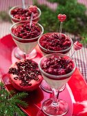 White chocolate mousse with red berries and pomegranate seeds
