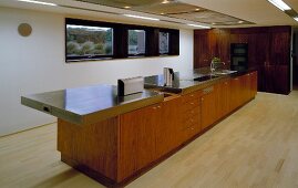 Long kitchen island in open-plan living space