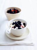 Rice pudding with poached cherries and blueberries