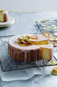 Iced lemon cake decorated with candied citrus fruits
