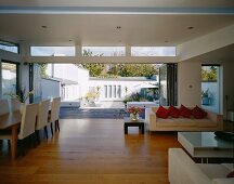 Dining area in living space with open folding terrace door