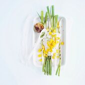 Steamed cod fillet with grilled spring onions and mango