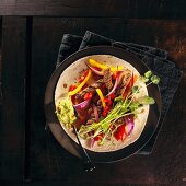Fajitas with beef, red onions and pepper