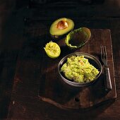 Classic Guacamole in a Glass Bowl; Fresh Avocados