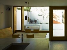 Open-plan kitchen and dining area with view of terrace