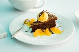 Chocolate tart with orange ice cream and orange fillets