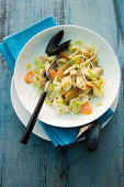 Pasta salad with mussels, carrots and leek