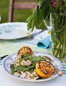 Grilled chicken with lemons, rocket and parmesan