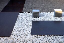 Steel plates bedded on gravel in entrance area