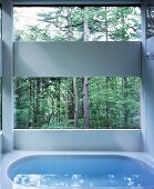 Bathroom with view of woods