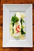 Steamed sole with lemon sauce and spinach