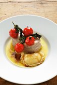 Steamed veal with potato pockets and tomatoes