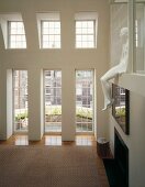 Hall with seated sculpture on shelf